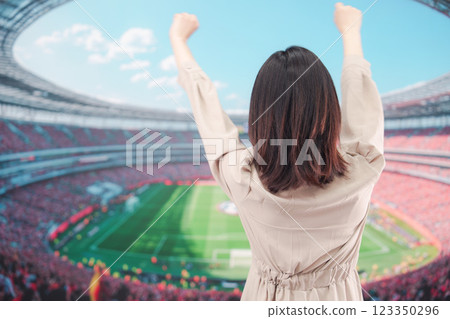 Young woman cheering at the stadium 123350296