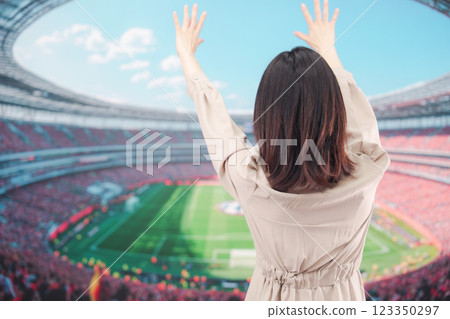 Young woman cheering at the stadium 123350297