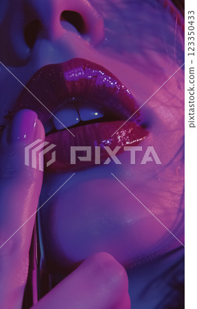 close-up of glossy lips in vibrant purple and pink neon light, with a finger gently touching them, creating an intimate and alluring scene filled with bold sensuality close-up of glossy lips in vibrant purple and pink neon light, with a finger gently touching them, creating an intimate and alluring scene filled with bold sensuality 123350433