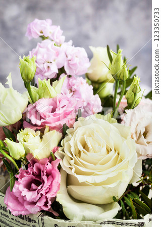 Bouquet of beautiful tender flowers - white and pink roses and lisianthus Bouquet of beautiful tender flowers - white and pink roses and lisianthus 123350733