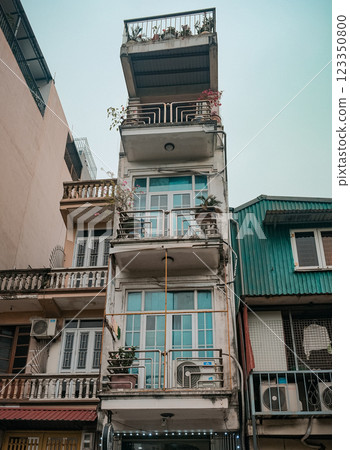 Captivating and Charming Vertical Architecture Set Within a Lively Urban Environment 123350800