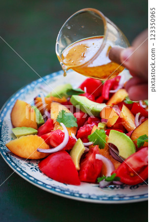 Fresh spring salad witn avocado, tomato, peach, red onion and herbs Fresh spring salad witn avocado, tomato, peach, red onion and herbs 123350965