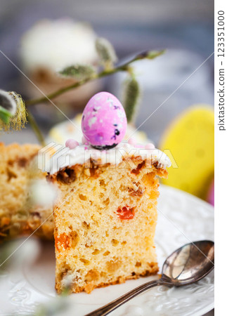 Sweet Easter bread, panettone or kulich and colorful painted eggs, Holiday spring concept 123351000