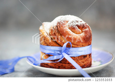 Sweet Easter bread, panettone or cruffin and colorful painted eggs, Holiday spring concept 123351033