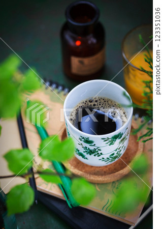 Cozy ceramic cup of cofee on spring background 123351036
