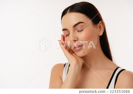 Relaxed Individual With Eyes Closed Enjoying a Peaceful Moment Relaxed Individual With Eyes Closed Enjoying a Peaceful Moment 123351088