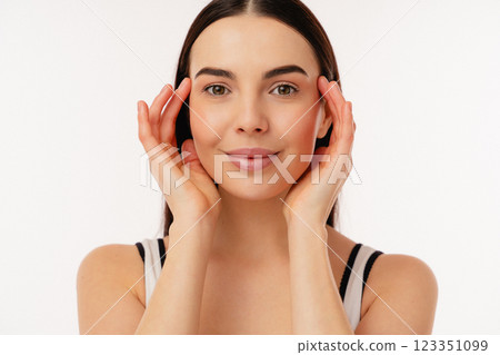 Portrait of a Smiling Woman Holding Her Face With Both Hands 123351099