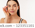 Close-Up Portrait of a Smiling Woman with a Thoughtful Expression 123351101