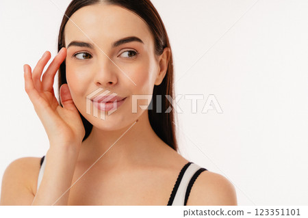 Close-Up Portrait of a Smiling Woman with a Thoughtful Expression 123351101