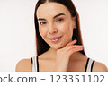 Bright Smiling Woman Posing with Clear Skin and Natural Charm 123351102