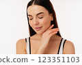 Young Person With Smooth Skin Showing a Natural Glow in Casual Attire 123351103