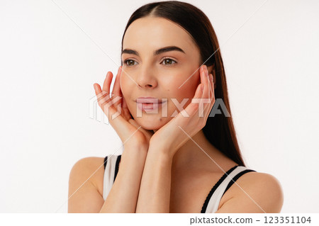 Portrait of Hands Touching Face on Isolated White Background Portrait of Hands Touching Face on Isolated White Background 123351104