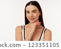 Confident Individual Posing with Neutral Expression in Bright Studio Setting 123351105