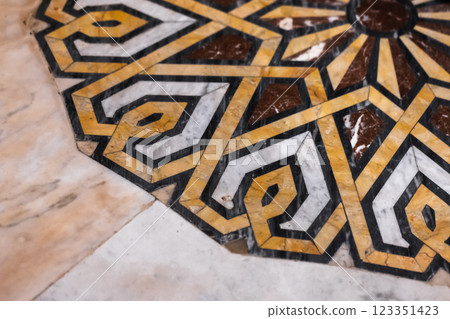 Intricate Geometric Marble Inlay Design with Bold Yellow Patterns Intricate Geometric Marble Inlay Design with Bold Yellow Patterns 123351423