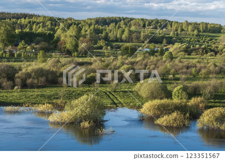 Vibrant rural scenery featuring a river floodplain 123351567