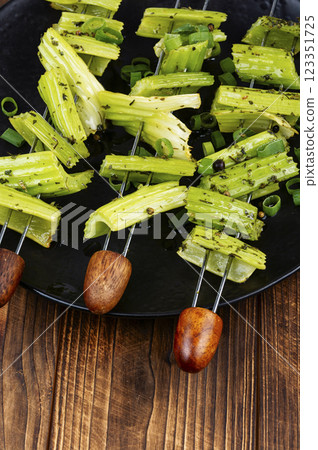 Green celery sticks on skewers, veggie style. Green celery sticks on skewers, veggie style. 123351725