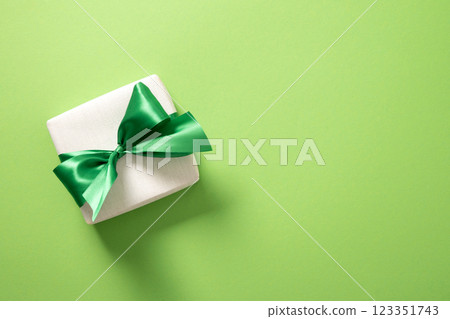 St Patricks day and March 17 gift on green background. View from above. Copy space St Patricks day and March 17 gift on green background. View from above. Copy space 123351743