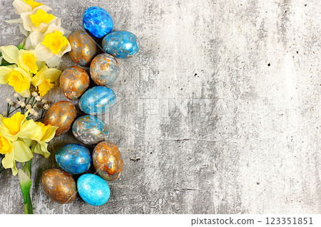 Happy Easter concept. Abstract Easter composition with marbled blue-gray decorated eggs and blooming daffodils, painted with hibiscus flowers. Banner for the screen with space for greeting text, Happy Easter concept. Abstract Easter composition with marbled blue-gray decorated eggs and blooming daffodils, painted with hibiscus flowers. Banner for the screen with space for greeting text, 123351851