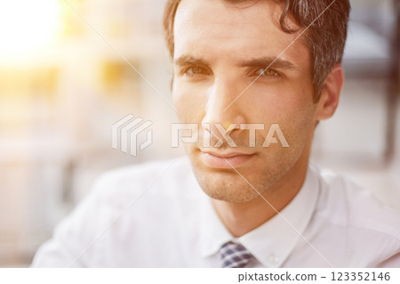 Confident young businessman posing in the office Confident young businessman posing in the office 123352146