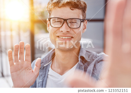 Portrait of smiling mid adult businessman standing at corporate office Portrait of smiling mid adult businessman standing at corporate office 123352151