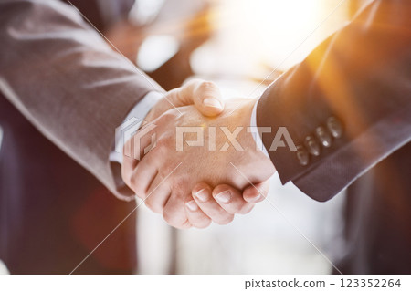 Extreme Closeup of Two Men Shaking Hands Extreme Closeup of Two Men Shaking Hands 123352264
