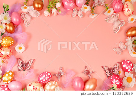 Abstract spring easter composition with pink painted eggs, feathers, butterflies, flowering branches and flowers. Happy easter concept. Screen banner with space for greeting text, 123352689