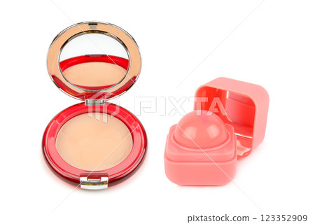 Powder compact and lip balm isolated on white background. Powder compact and lip balm isolated on white background. 123352909