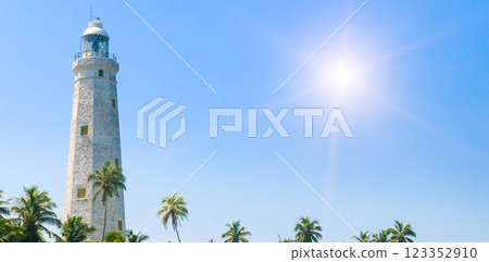 White lighthouse Dondra Head and tropical palms, Sri Lanka, near Matara. White lighthouse Dondra Head and tropical palms, Sri Lanka, near Matara. 123352910