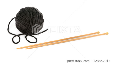 Ball of thread and knitting needles isolated on white background. Ball of thread and knitting needles isolated on white background. 123352912