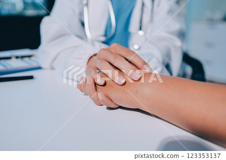 Closeup, doctor holding hands with senior woman and cancer care or support. Healthcare or trust, empathy or compassion and female caregiver or nurse holding elderly person hand for hope and kindness 123353137