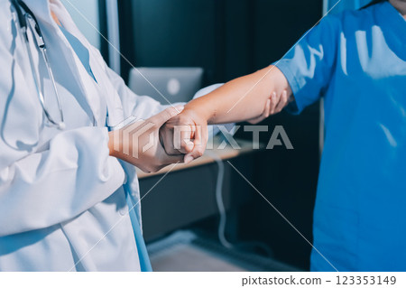 Orthopedist examining patient in hospital Orthopedist examining patient in hospital 123353149