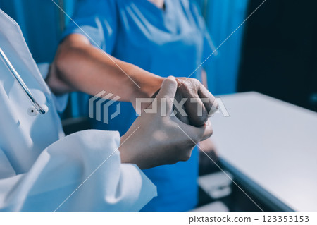 Orthopedist examining patient in hospital 123353153