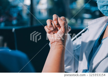 Orthopedist examining patient in hospital 123353154