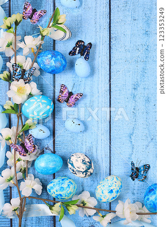 Happy Easter concept, Composition with decorated Easter eggs, butterflies and apple tree branches. banner or advertisement for screen or store, template for design, spring card, selective focus 123353249