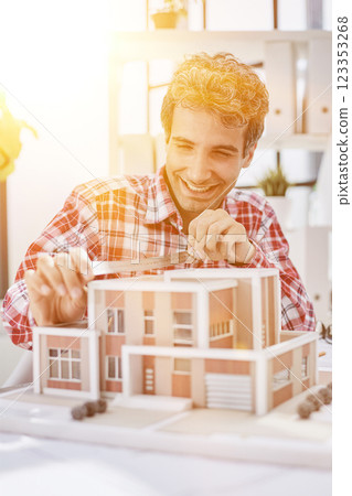 architect design working drawing sketch plans blueprints and making architectural construction model in architect studio architect design working drawing sketch plans blueprints and making architectural construction model in architect studio 123353268