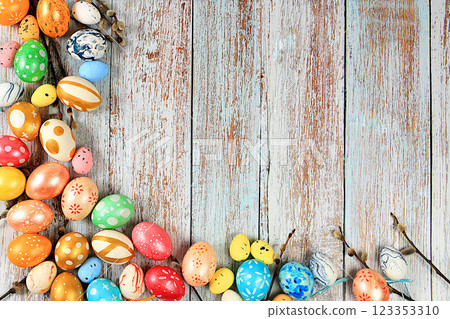 Composition with decorated Easter eggs and willow branches. Happy Easter concept, banner or advertisement for screen or store, template for design, spring card, selective focus 123353310