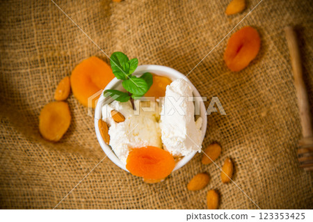 Healthy cottage cheese dessert with nuts and dried fruits 123353425