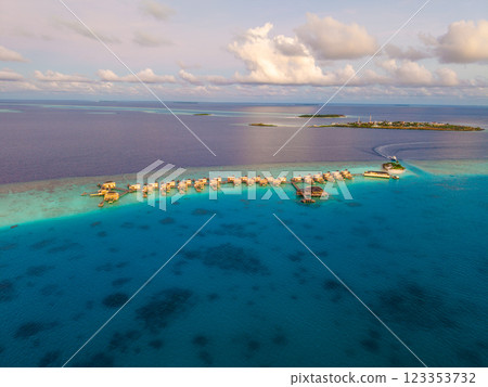 Aerial views of Velavaru Island at sunset in Maldives 123353732