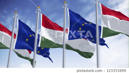 Flags of Hungary and the European Union fluttering together on a clear day Flags of Hungary and the European Union fluttering together on a clear day 123353899
