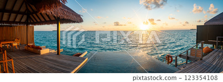 Sunset views from overwater pool villa in Maldives Sunset views from overwater pool villa in Maldives 123354108