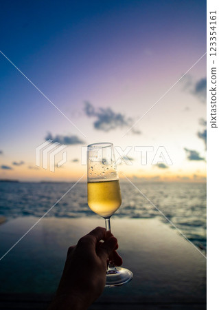 Sunset views from overwater pool villa in Maldives 123354161