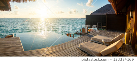 Sunset views from overwater pool villa in Maldives Sunset views from overwater pool villa in Maldives 123354169