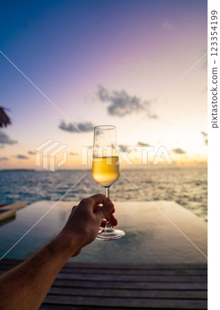 Sunset views from overwater pool villa in Maldives 123354199