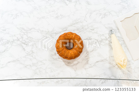 The freshly baked Carrot Bundt Cake is beautifully frosted with a luscious layer of cream cheese frosting. 123355133