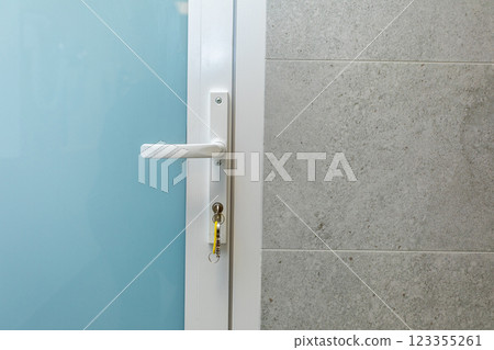 Contemporary Modern Door and Handle Design Featuring a Stylish Textured Wall Background Contemporary Modern Door and Handle Design Featuring a Stylish Textured Wall Background 123355261
