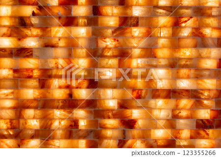 An Elegant Illuminated Salt Wall with Warm Tones creates a serene atmosphere for all 123355266