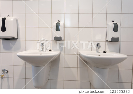 Thoroughly Clean and Maintain Modern Restroom Sinks to Ensure Hygiene and Comfort Thoroughly Clean and Maintain Modern Restroom Sinks to Ensure Hygiene and Comfort 123355283