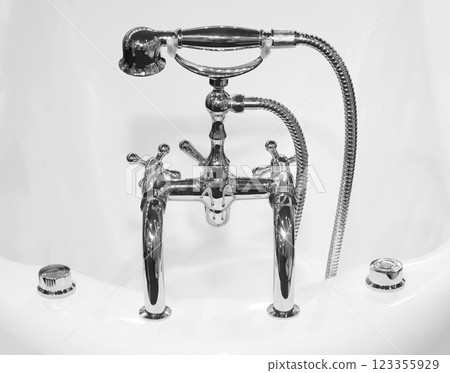 Vintage bathtub faucet fixture Vintage bathtub faucet fixture 123355929