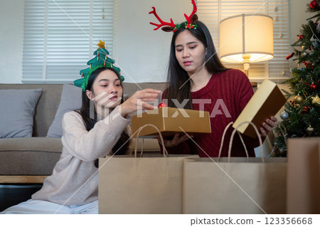 Thoughtful Lesbian Duo Preparing Holiday Packages A Festive Tradition Embraced with Care and Fellowship Thoughtful Lesbian Duo Preparing Holiday Packages A Festive Tradition Embraced with Care and Fellowship 123356668