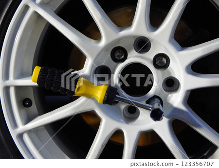 Wheel Wrench For Mounting Car Rim Inserted In Wheel 123356707